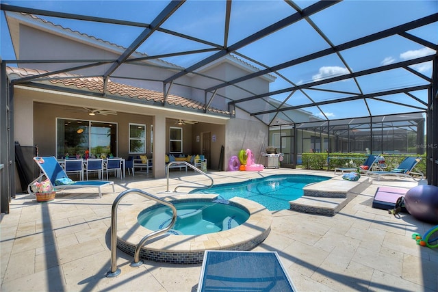 8020 Oak Shadow Ct, Davenport, FL 33837 - view of swimming pool featuring ceiling fan, a patio area, a pool with connected hot tub, and glass enclosure
