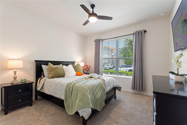 8020 Oak Shadow Ct, Davenport, FL 33837 - bedroom featuring light carpet and a ceiling fan