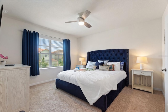 8020 Oak Shadow Ct, Davenport, FL 33837 - bedroom with light colored carpet and a ceiling fan