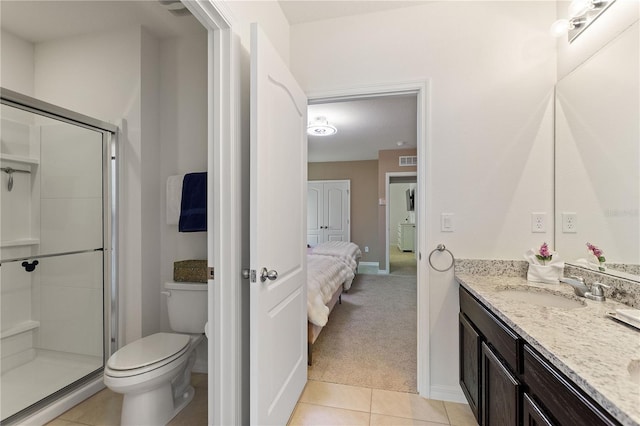 8020 Oak Shadow Ct, Davenport, FL 33837 - ensuite bathroom featuring vanity, a shower stall, and tile patterned flooring