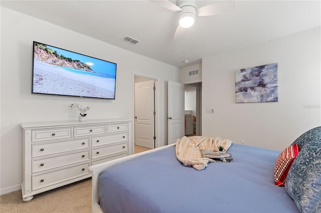 8020 Oak Shadow Ct, Davenport, FL 33837 - bedroom featuring light carpet and a ceiling fan