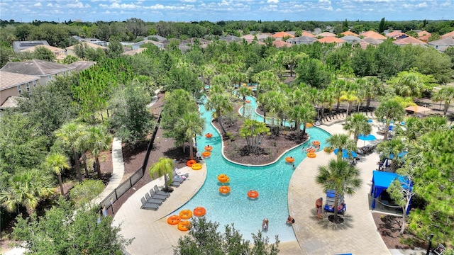 8020 Oak Shadow Ct, Davenport, FL 33837 - aerial perspective of suburban area with a pool area and a tree filled landscape