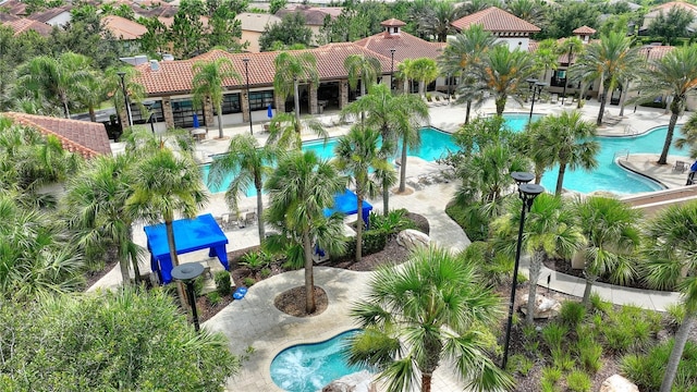 8020 Oak Shadow Ct, Davenport, FL 33837 - community pool featuring a patio