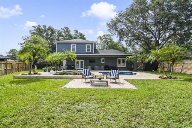 8445 Shady Glen Dr, Orlando, FL 32819 - back of house featuring french doors, a patio area, an outdoor living space, and a fenced backyard