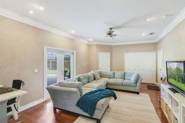 8445 Shady Glen Dr, Orlando, FL 32819 - living area with french doors, wood finished floors, ceiling fan, ornamental molding, and recessed lighting