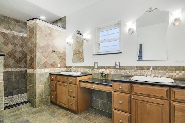 8445 Shady Glen Dr, Orlando, FL 32819 - bathroom featuring tile walls, two vanities, a walk in shower, and recessed lighting