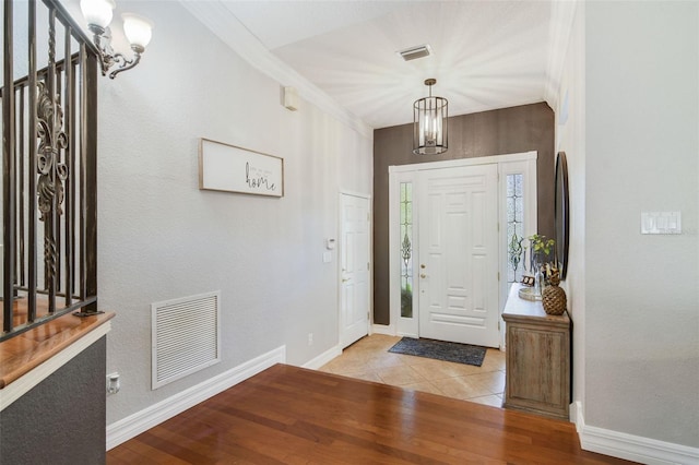 8445 Shady Glen Dr, Orlando, FL 32819 - foyer entrance with wood finished floors and a chandelier