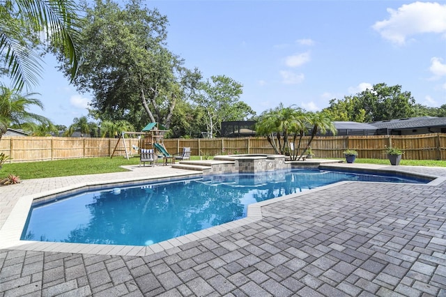 8445 Shady Glen Dr, Orlando, FL 32819 - view of swimming pool featuring a patio, a fenced backyard, a playground, and a pool with connected hot tub