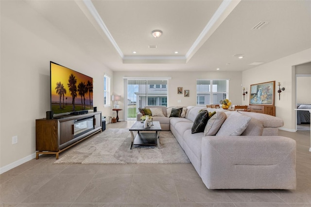 3702 Haddon Ave, Davenport, FL 33837 - living area with a tray ceiling, tile patterned floors, recessed lighting, and crown molding