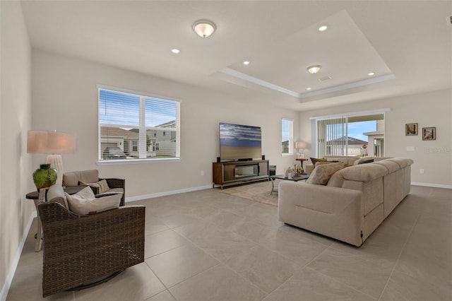3702 Haddon Ave, Davenport, FL 33837 - living room featuring a tray ceiling, recessed lighting, and light tile patterned flooring