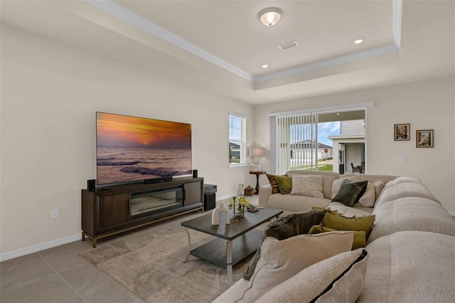 3702 Haddon Ave, Davenport, FL 33837 - tiled living area featuring a tray ceiling, ornamental molding, and recessed lighting
