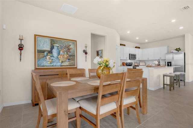 3702 Haddon Ave, Davenport, FL 33837 - dining space with recessed lighting and light tile patterned flooring
