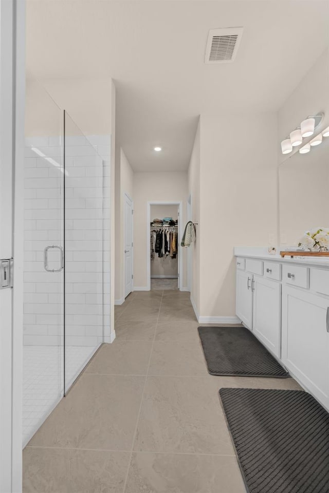 3702 Haddon Ave, Davenport, FL 33837 - full bath featuring a shower stall, vanity, a spacious closet, tile patterned floors, and recessed lighting
