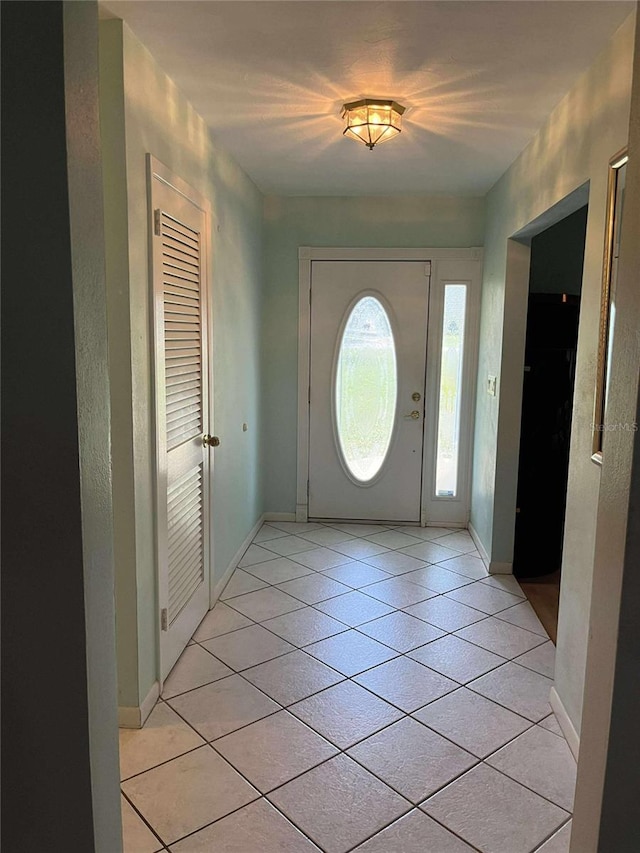 608 Knowles Rd, Brandon, FL 33511 - foyer featuring light tile patterned floors and baseboards