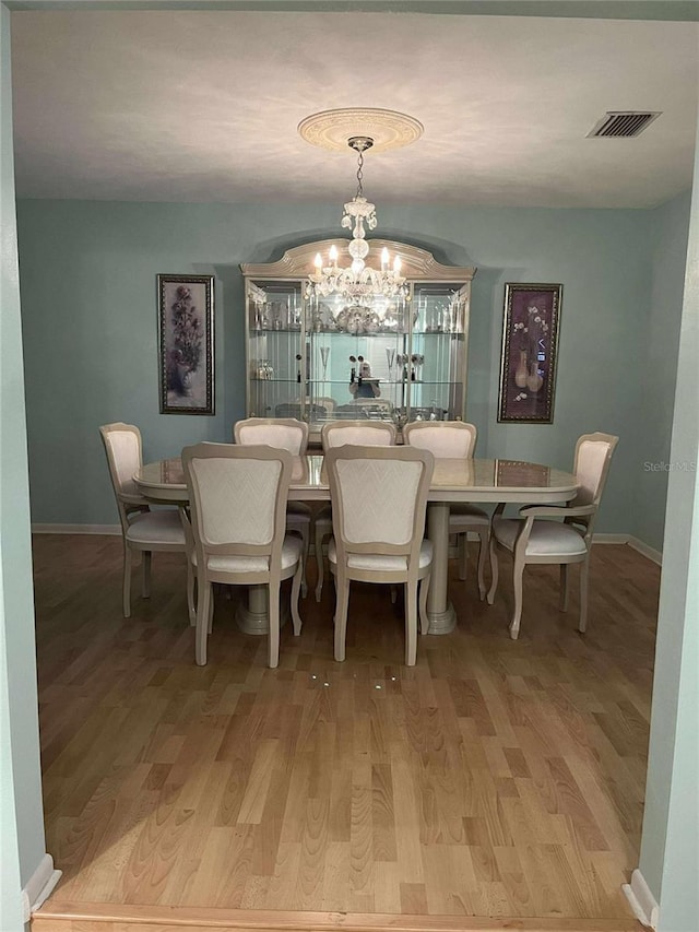 608 Knowles Rd, Brandon, FL 33511 - dining area featuring a chandelier and light wood-type flooring