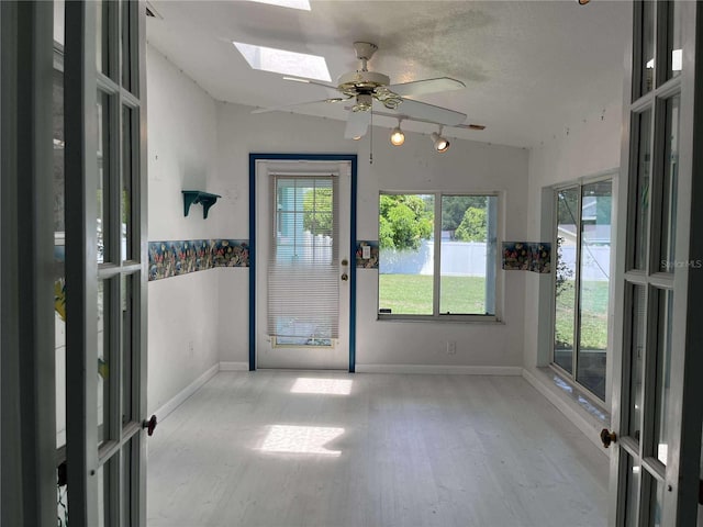 608 Knowles Rd, Brandon, FL 33511 - unfurnished sunroom with a skylight, plenty of natural light, and a water view