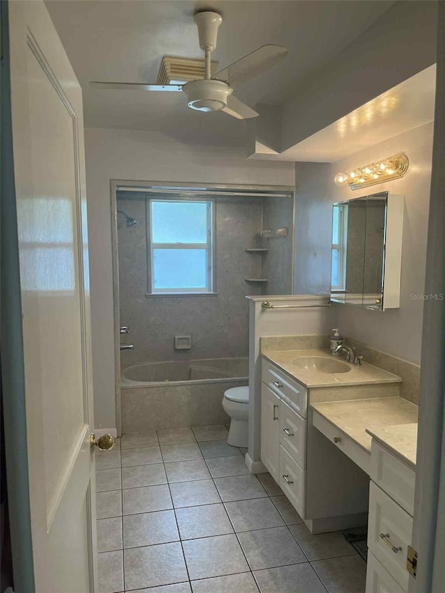 608 Knowles Rd, Brandon, FL 33511 - full bathroom featuring tile patterned flooring, vanity, tiled shower / bath combo, and a ceiling fan