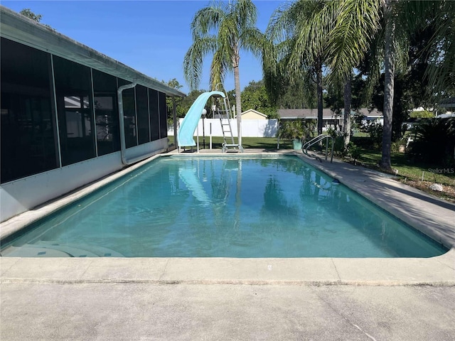 608 Knowles Rd, Brandon, FL 33511 - view of swimming pool with a sunroom and a water slide
