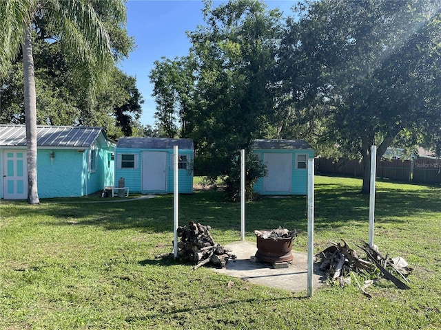 608 Knowles Rd, Brandon, FL 33511 - view of yard featuring a shed and an outdoor fire pit