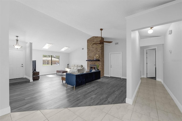 2025 Mango Tree Dr, Edgewater, FL 32141 - living room featuring a fireplace, ceiling fan, lofted ceiling, and ornamental molding