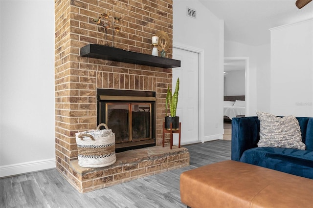 2025 Mango Tree Dr, Edgewater, FL 32141 - living room with wood finished floors and a fireplace