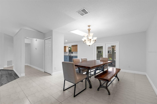 2025 Mango Tree Dr, Edgewater, FL 32141 - dining area featuring a chandelier and french doors