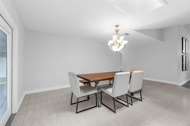 2025 Mango Tree Dr, Edgewater, FL 32141 - dining space with a chandelier and baseboards