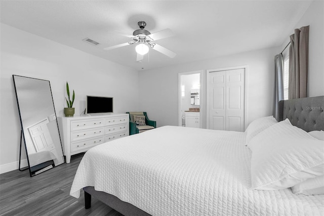 2025 Mango Tree Dr, Edgewater, FL 32141 - bedroom featuring dark wood-type flooring, connected bathroom, ceiling fan, and a closet