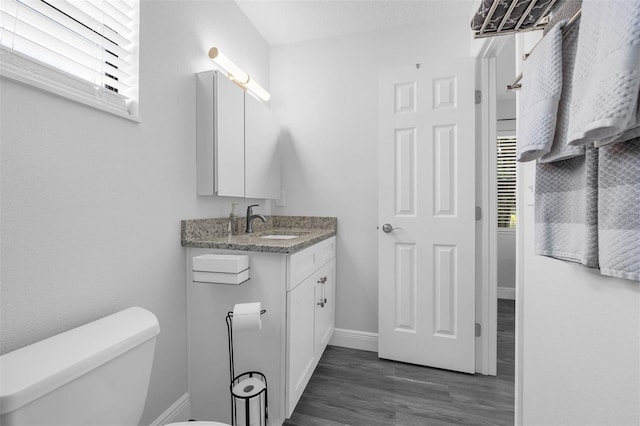 2025 Mango Tree Dr, Edgewater, FL 32141 - bathroom featuring vanity, healthy amount of natural light, and wood finished floors
