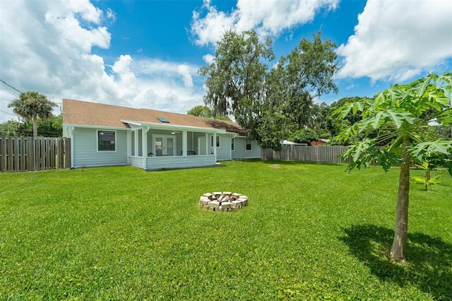 2025 Mango Tree Dr, Edgewater, FL 32141 - back of property with a fenced backyard and an outdoor fire pit
