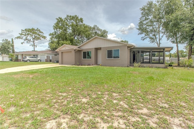 663 Courtland Blvd, Deltona, FL 32738 - single story home featuring a sunroom, driveway, a front lawn, and brick siding