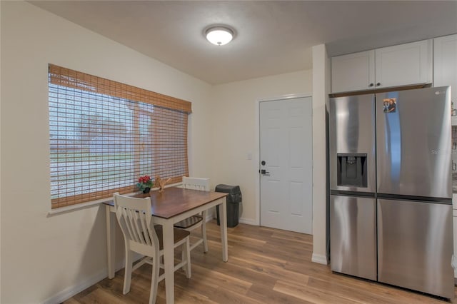 663 Courtland Blvd, Deltona, FL 32738 - dining room with light wood-style floors