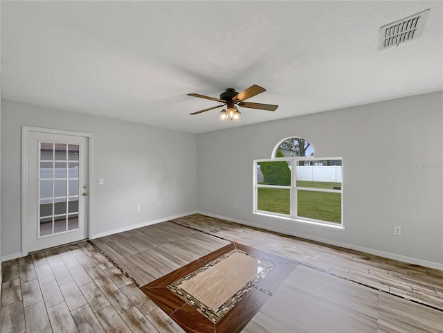 1301 Brenway Dr, Mascotte, FL 34753 - empty room featuring wood finished floors and a ceiling fan