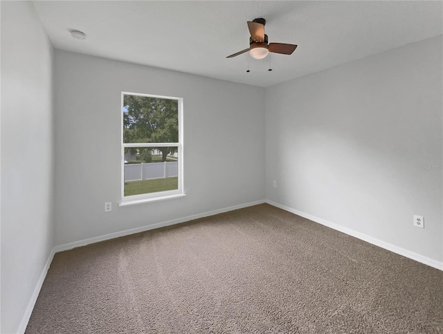 1301 Brenway Dr, Mascotte, FL 34753 - empty room featuring a ceiling fan, carpet floors, and a smoke detector