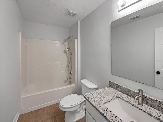 1301 Brenway Dr, Mascotte, FL 34753 - full bath featuring vanity, shower / tub combination, a textured ceiling, and tile patterned floors