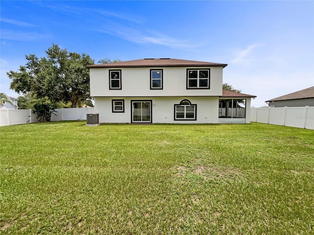 1301 Brenway Dr, Mascotte, FL 34753 - back of property featuring stucco siding, a fenced backyard, and a sunroom