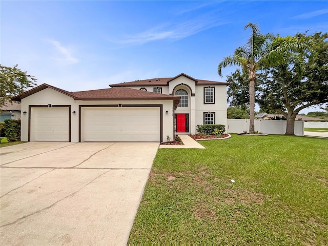 1301 Brenway Dr, Mascotte, FL 34753 - view of front facade with stucco siding, an attached garage, and driveway