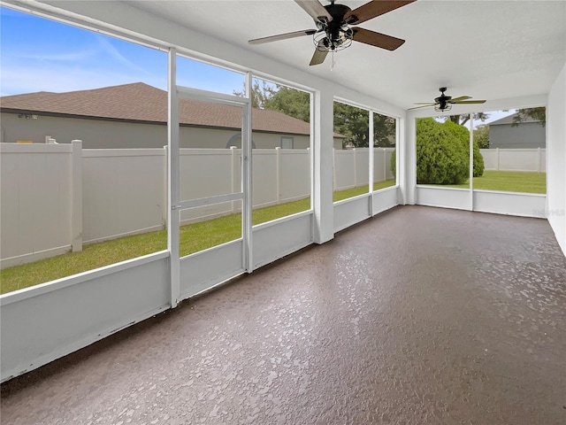 1301 Brenway Dr, Mascotte, FL 34753 - unfurnished sunroom featuring a ceiling fan and plenty of natural light