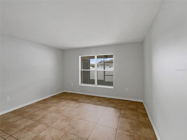1301 Brenway Dr, Mascotte, FL 34753 - empty room with light tile patterned floors and baseboards