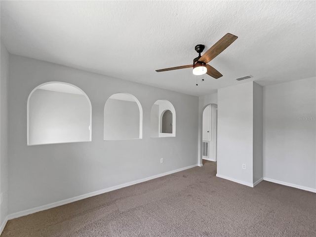 1301 Brenway Dr, Mascotte, FL 34753 - unfurnished room featuring ceiling fan, carpet, and a textured ceiling