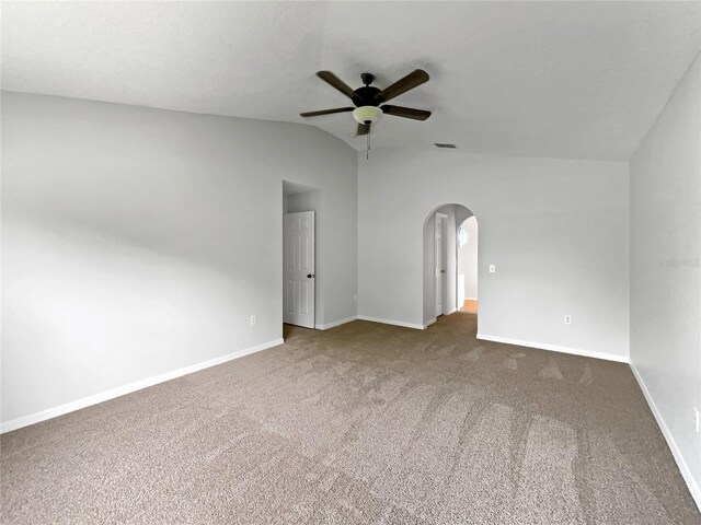 1301 Brenway Dr, Mascotte, FL 34753 - carpeted spare room with a ceiling fan, arched walkways, and vaulted ceiling