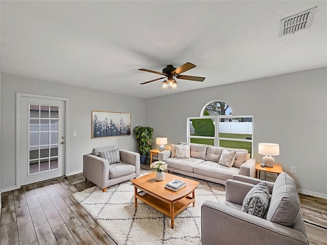 1301 Brenway Dr, Mascotte, FL 34753 - living area with wood finished floors and ceiling fan