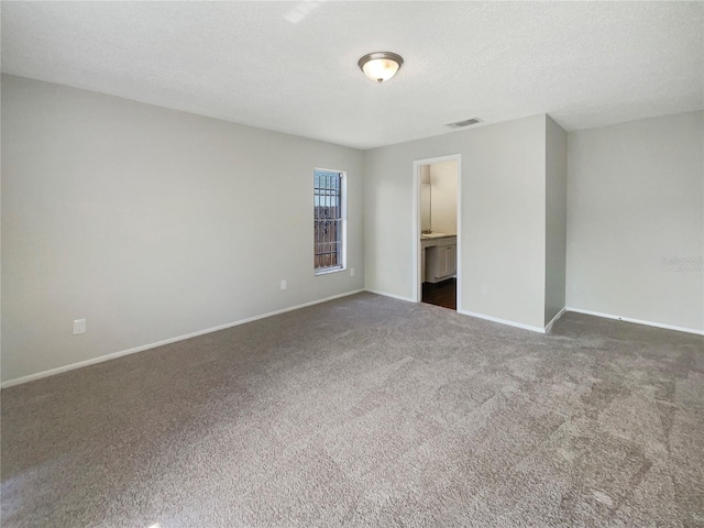 6460 Preakness Dr, Orlando, FL 32818 - empty room featuring carpet floors and a textured ceiling