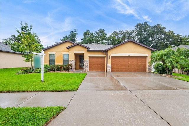 2236 Landside Dr, Valrico, FL 33594 - ranch-style home with stucco siding, an attached garage, stone siding, driveway, and a front lawn