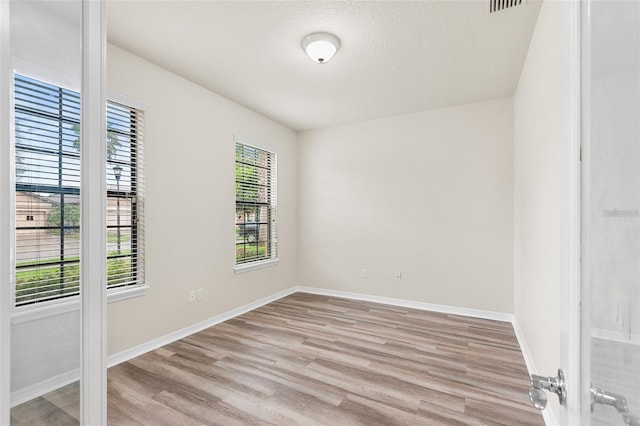 2236 Landside Dr, Valrico, FL 33594 - spare room featuring light wood-style floors and baseboards