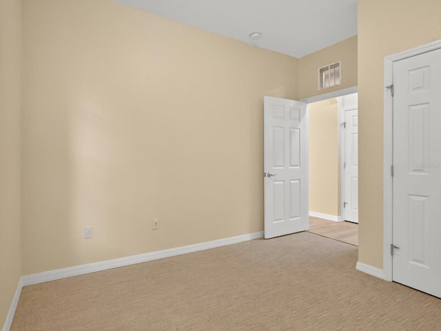 1353 Venezia Ct Unit 205, Davenport, FL 33896 - unfurnished bedroom featuring light colored carpet and baseboards