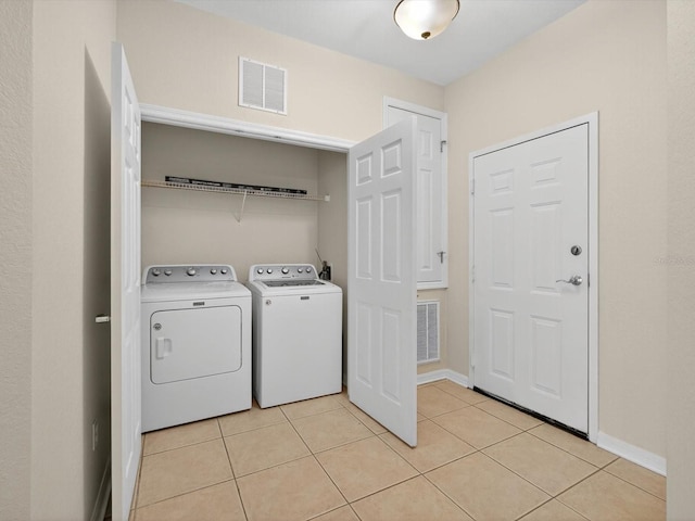 1353 Venezia Ct Unit 205, Davenport, FL 33896 - laundry area featuring independent washer and dryer and light tile patterned floors