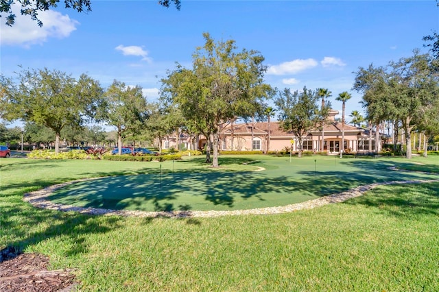 1353 Venezia Ct Unit 205, Davenport, FL 33896 - view of property's community featuring an area to practice putting and a lawn