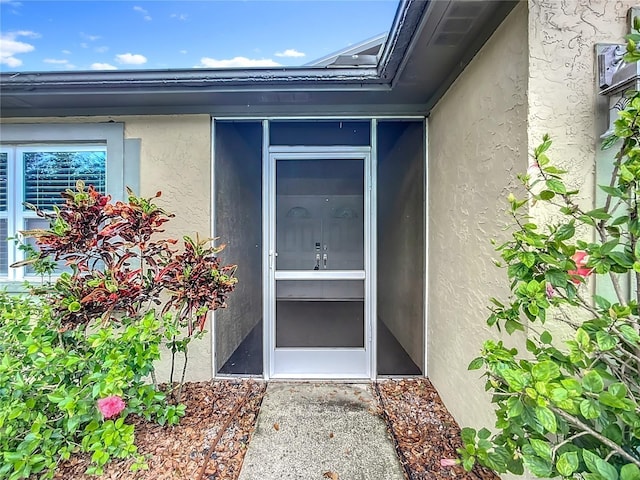 10901 Peppersong Dr, Riverview, FL 33578 - doorway to property with stucco siding