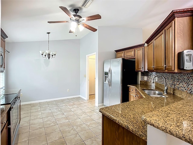 10901 Peppersong Dr, Riverview, FL 33578 - kitchen with appliances with stainless steel finishes, a ceiling fan, backsplash, a chandelier, and dark stone counters